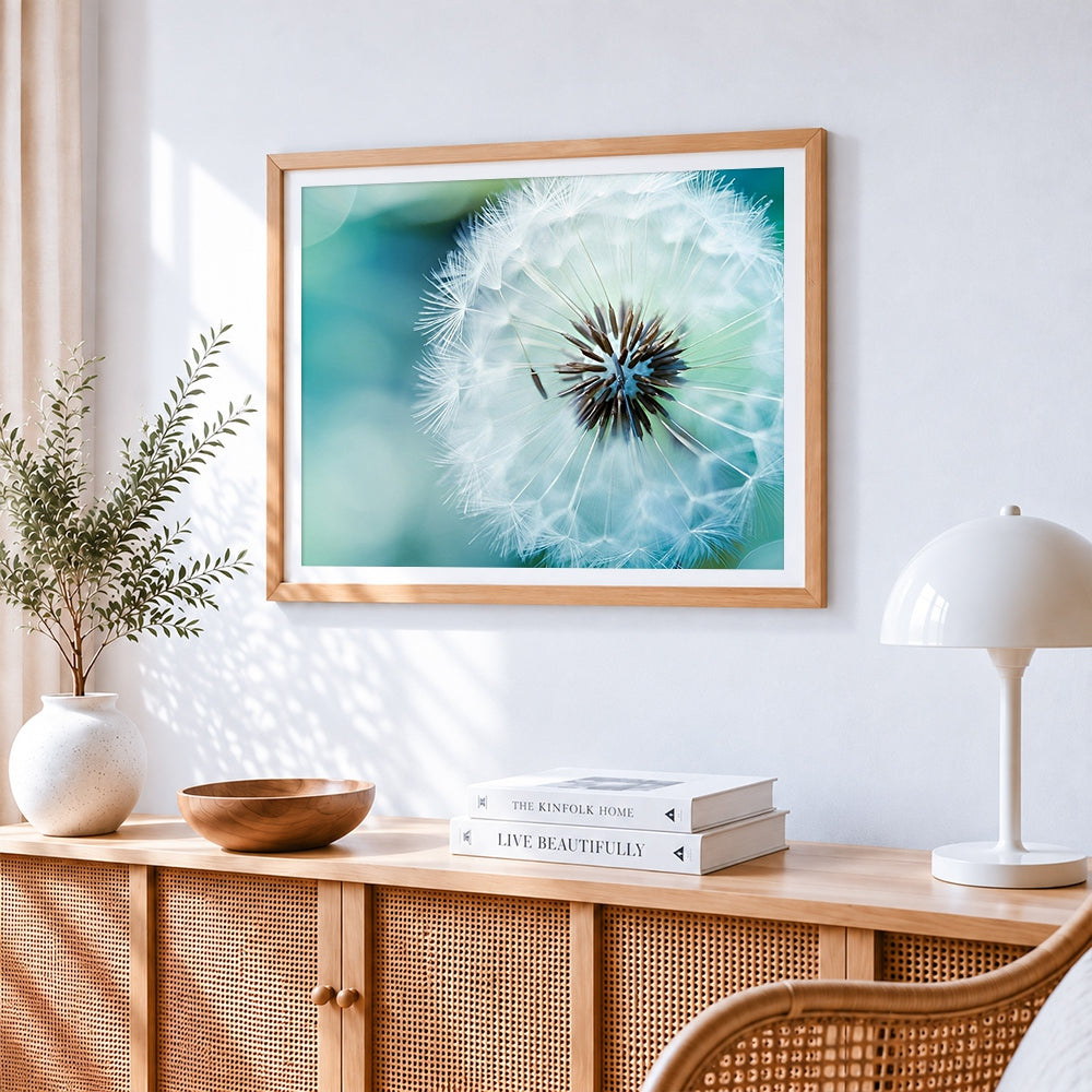Blue dandelion cross stitch artwork displayed on wall as home decor