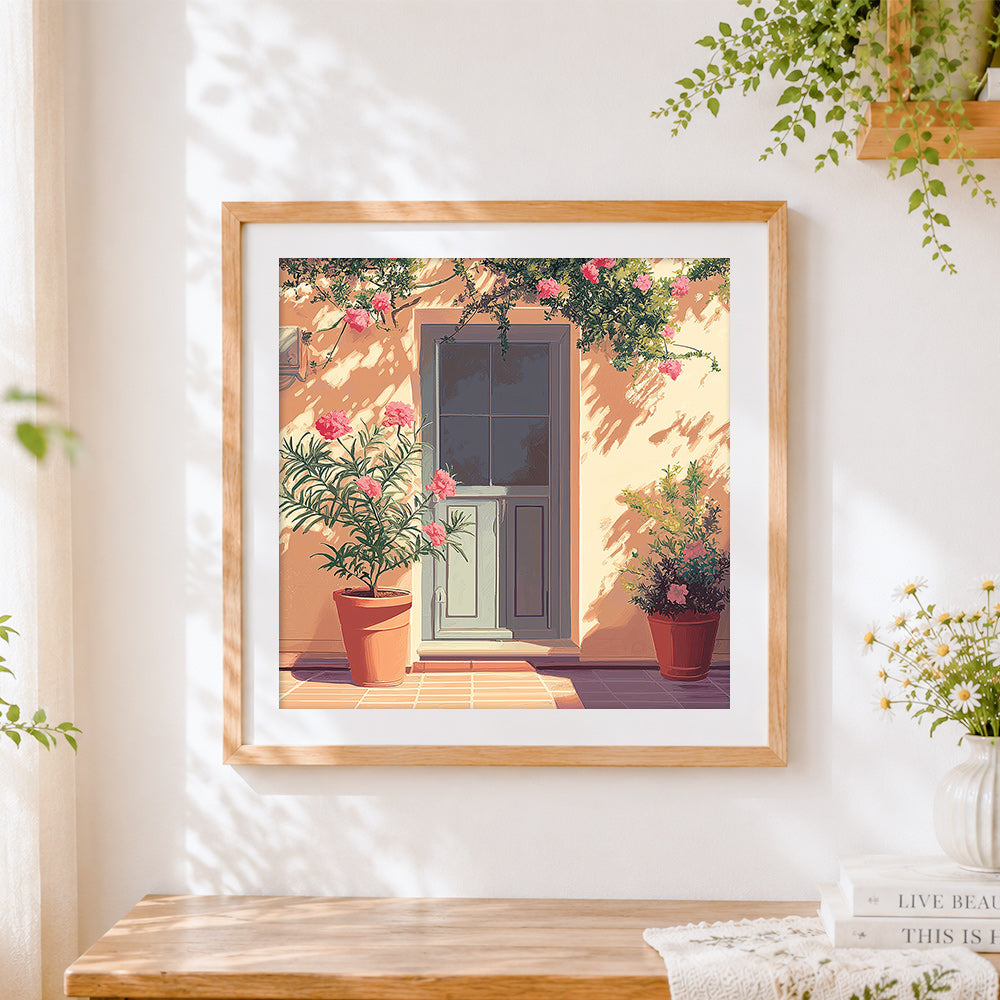 Finished blue door and pink oleander cross stitch artwork displayed