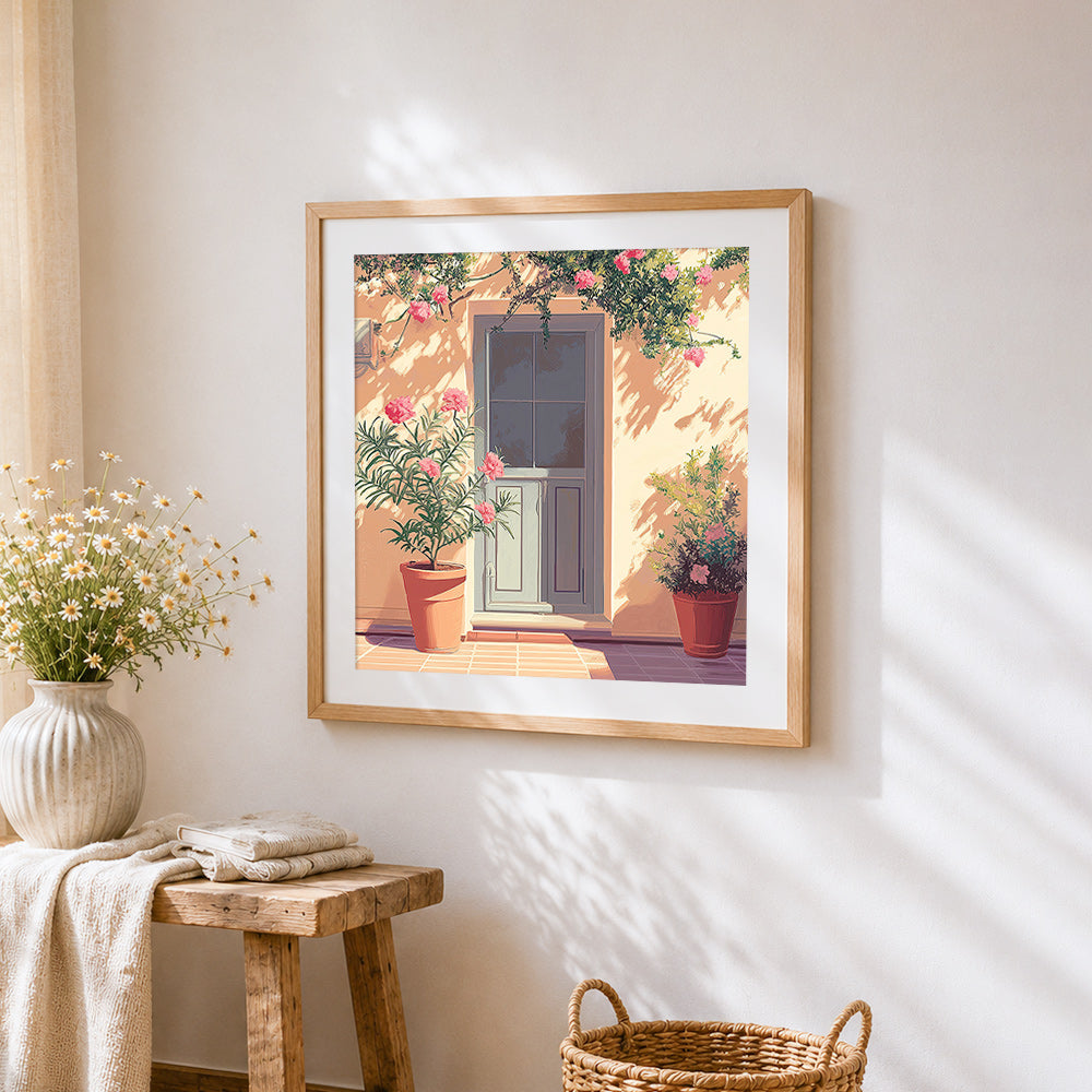 Blue door and pink oleander cross stitch artwork displayed on wall as home decor