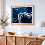 Blue eyed cat with bubbles cross stitch artwork displayed on wall as home decor