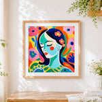 Finished blue faced woman with flowers cross stitch artwork displayed