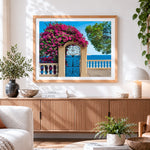 Finished blue gate with bougainvillea cross stitch artwork displayed
