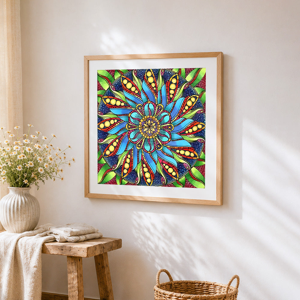 Blue green and red floral mandala cross stitch artwork displayed on wall as home decor