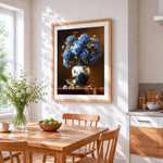 Blue hydrangeas in a chinoiserie vase cross stitch artwork displayed on wall as home decor