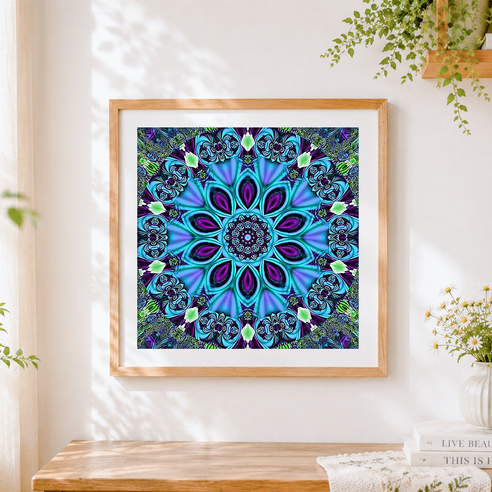 Finished blue kaleidoscope mandala cross stitch artwork displayed