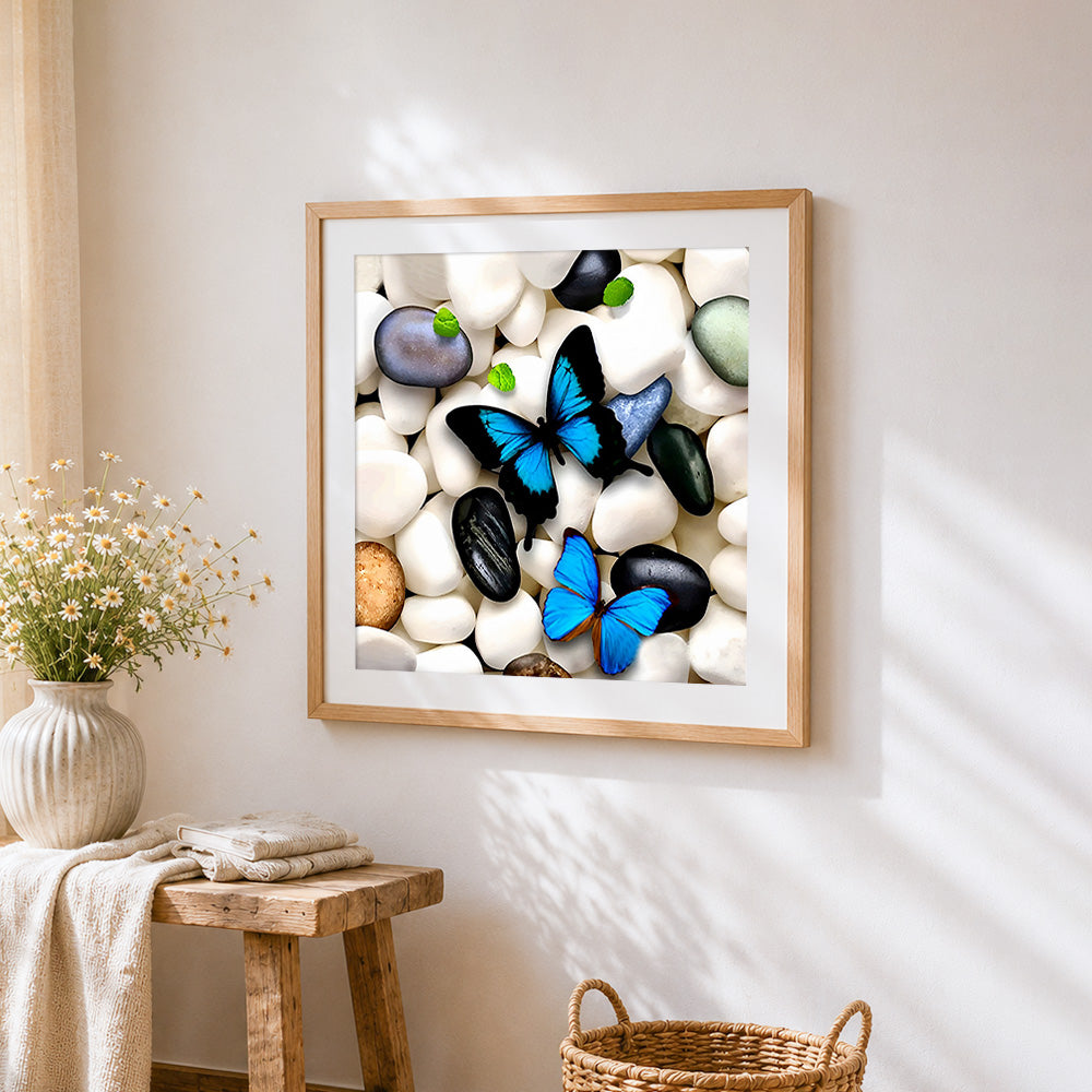 Blue morpho butterflies on white pebbles paint by numbers artwork displayed on wall as home decor