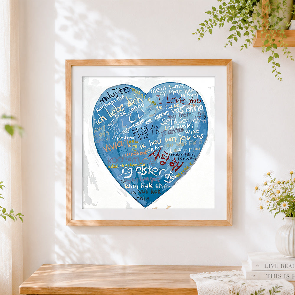 Finished blue multi language i love you heart cross stitch artwork displayed