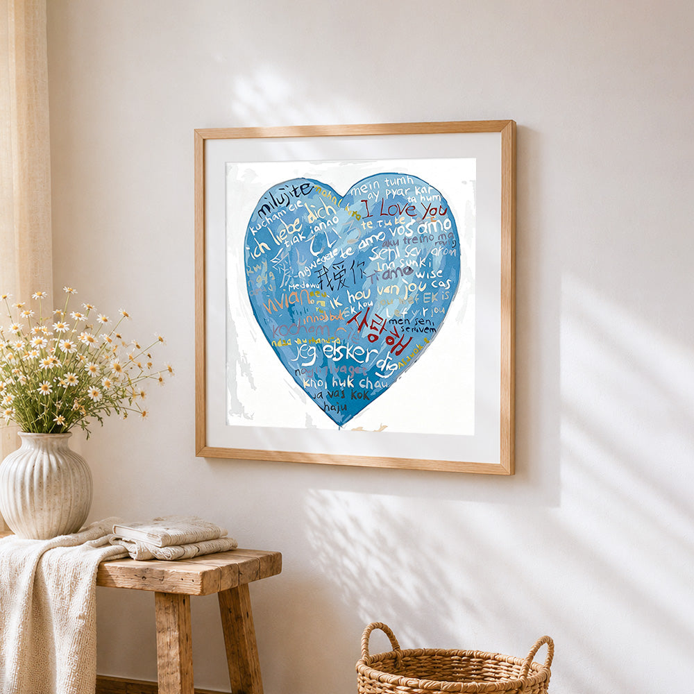 Blue multi language i love you heart cross stitch artwork displayed on wall as home decor