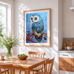 Blue owl and stars cross stitch artwork displayed on wall as home decor
