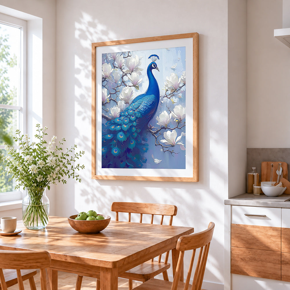 Blue peacock on magnolia branch cross stitch artwork displayed on wall as home decor