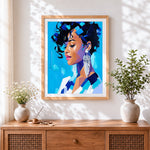 Finished blue portrait of a woman cross stitch artwork displayed