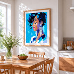 Blue portrait of a woman cross stitch artwork displayed on wall as home decor