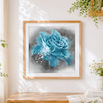 Finished blue rose with water splashes cross stitch artwork displayed