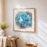 Blue rose with water splashes cross stitch artwork displayed on wall as home decor