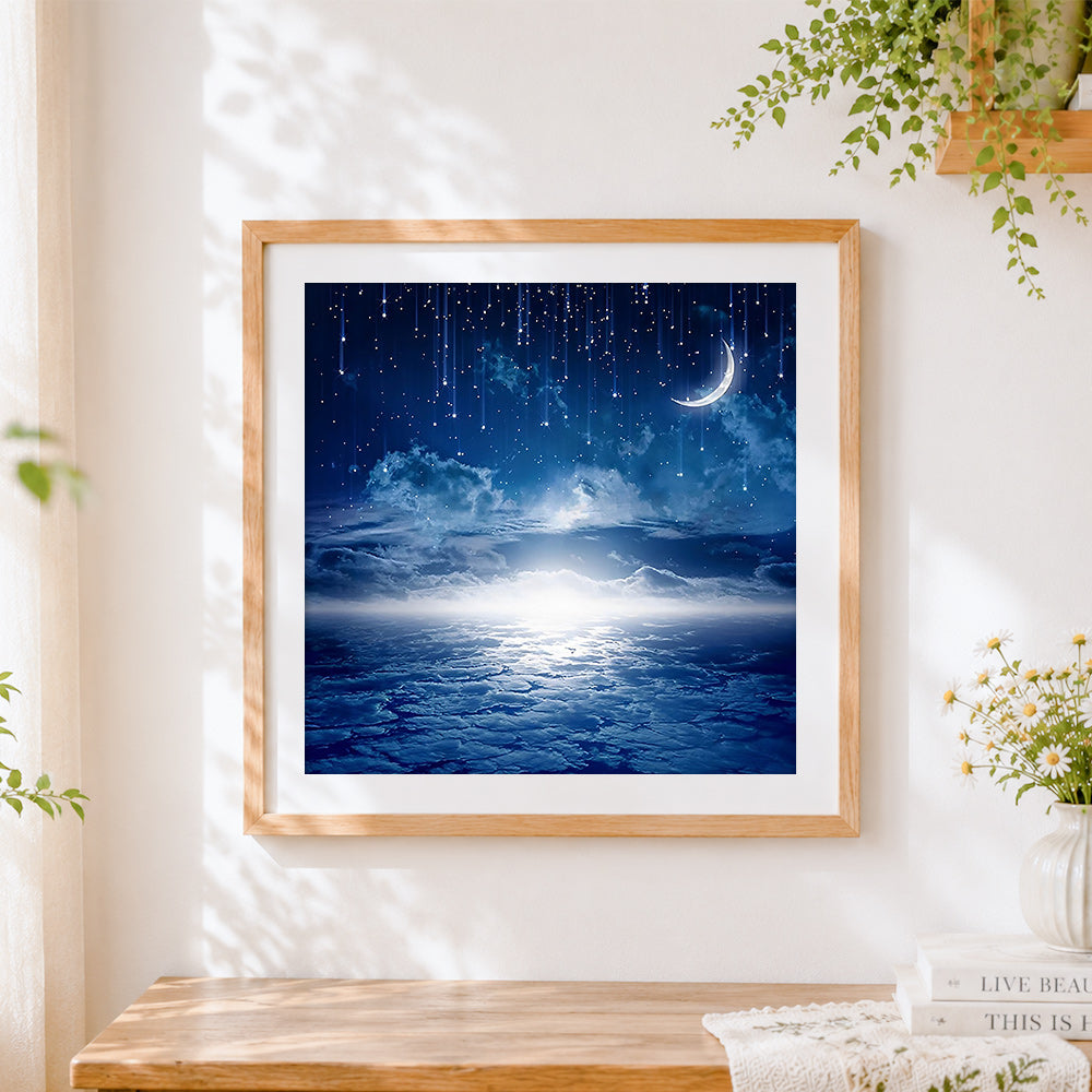 Finished blue starry night and crescent moon cross stitch artwork displayed