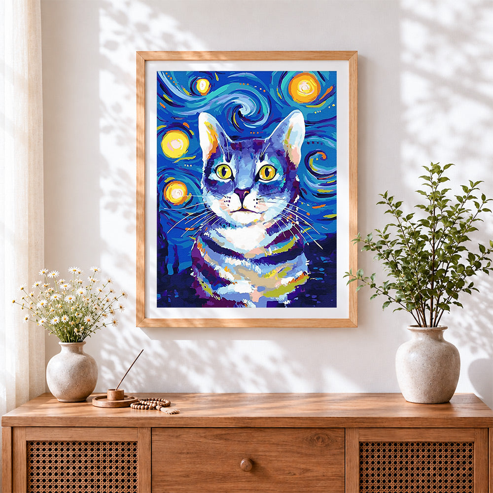 Finished blue starry night cat cross stitch artwork displayed