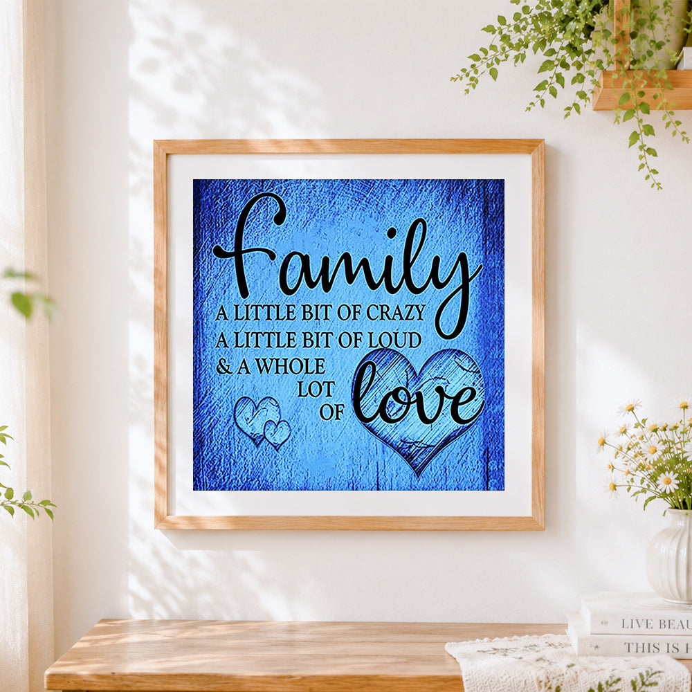 Finished blue texture family quote cross stitch artwork displayed