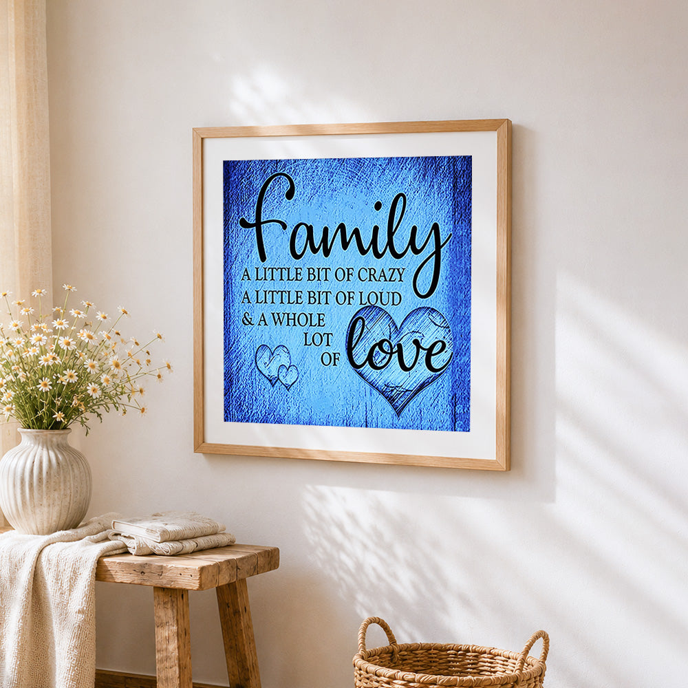 Blue texture family quote cross stitch artwork displayed on wall as home decor
