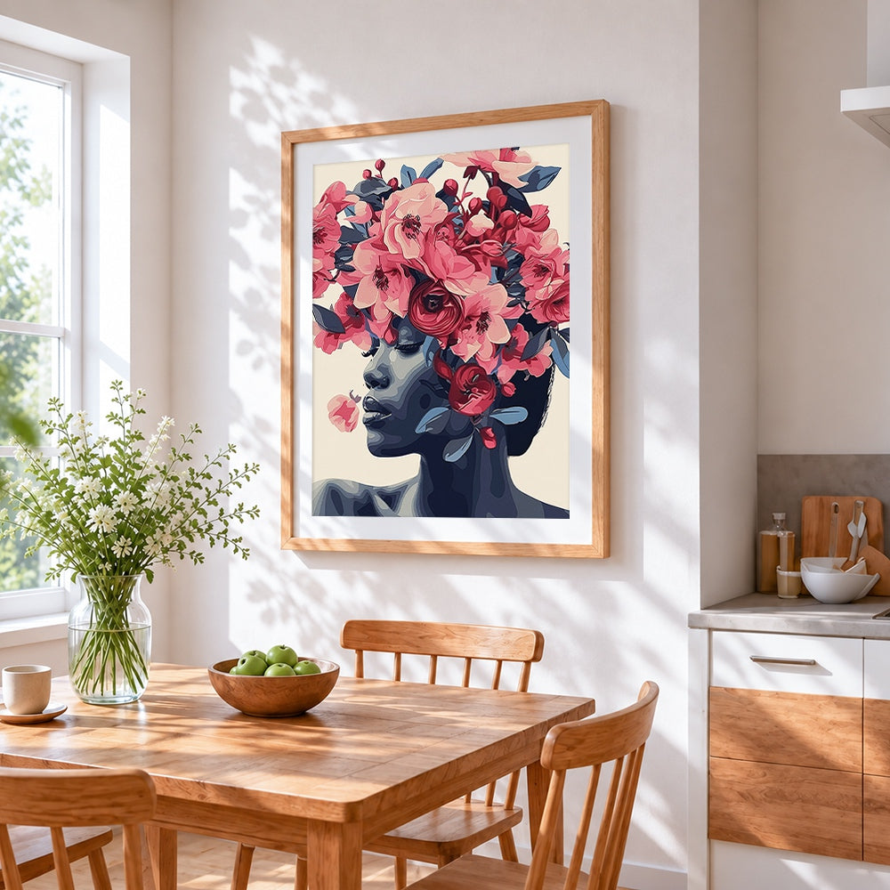 Blue toned woman with pink blossoms cross stitch artwork displayed on wall as home decor