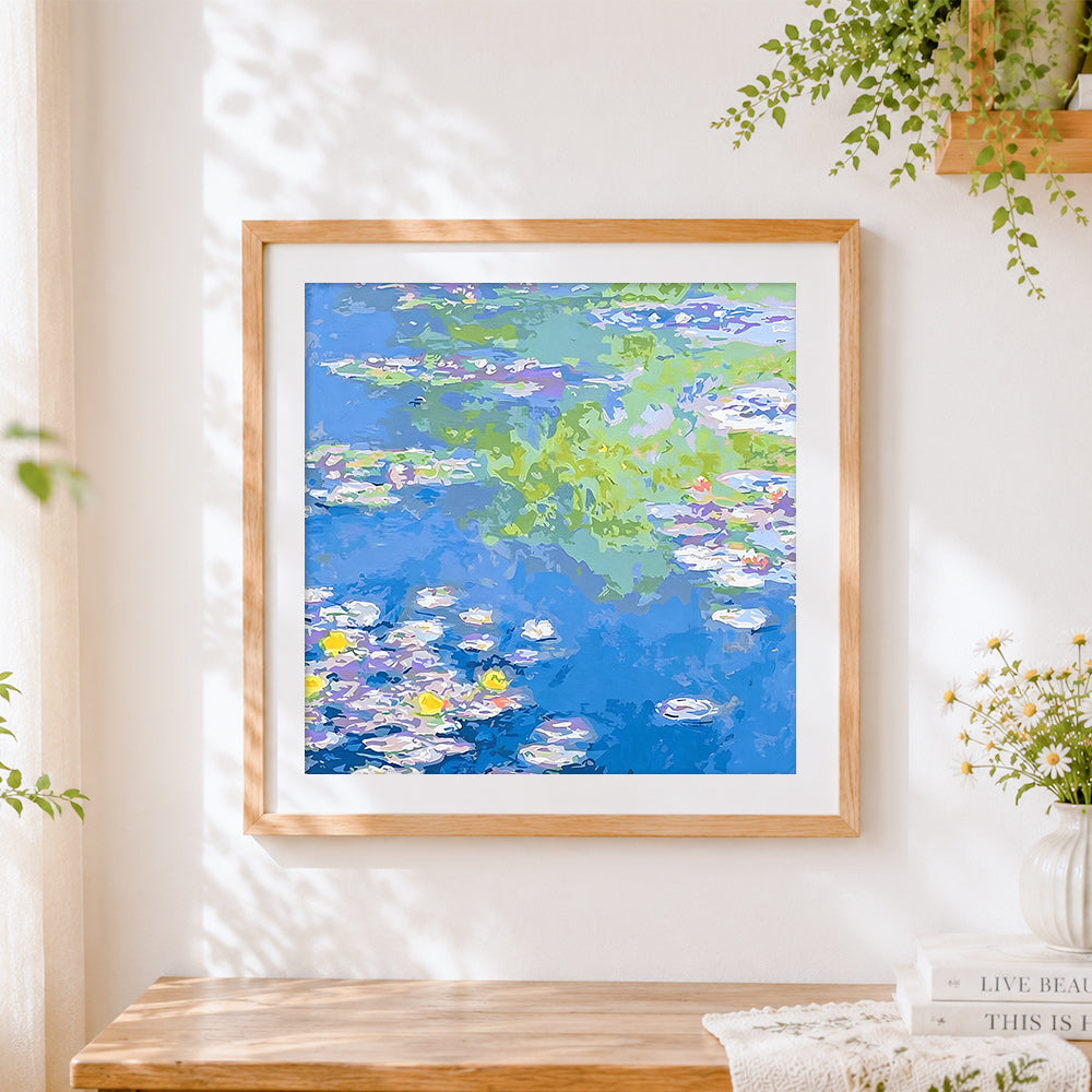 Finished blue water lily pond cross stitch artwork displayed