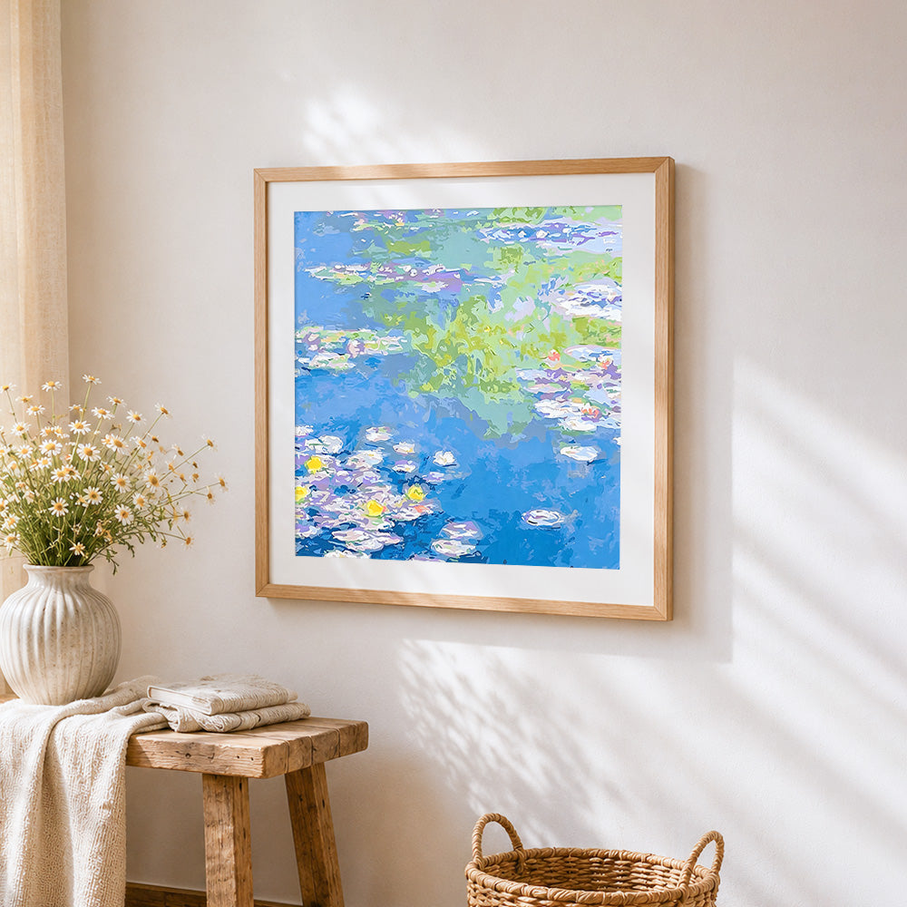 Blue water lily pond cross stitch artwork displayed on wall as home decor