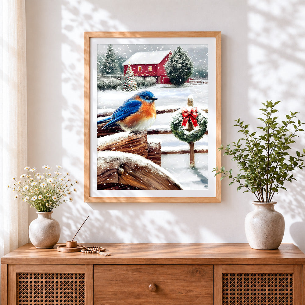 Finished bluebird on a snowy fence with wreath cross stitch artwork displayed