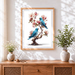 Finished bluebirds on a blossom tree cross stitch artwork displayed