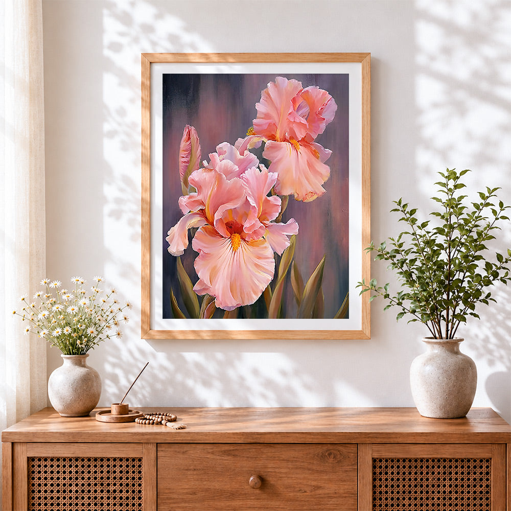Finished blush pink irises cross stitch artwork displayed