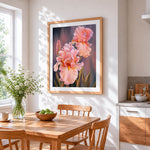 Blush pink irises cross stitch artwork displayed on wall as home decor