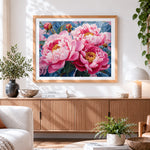Finished blush pink peonies close up cross stitch artwork displayed