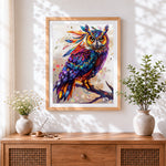 Finished bohemian rainbow owl cross stitch artwork displayed