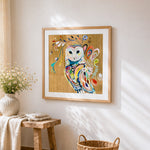 Boho floral owl cross stitch artwork displayed on wall as home decor