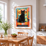 Bold black cat in orange armchair cross stitch artwork displayed on wall as home decor