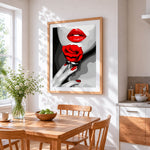 Bold red lips and rose cross stitch artwork displayed on wall as home decor