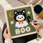 Creating handmade boo ghost cat punch needle artwork