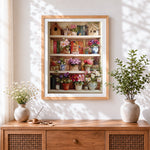 Finished bookshelf with flowers and birdhouses cross stitch artwork displayed