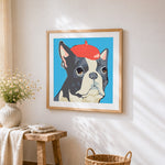 Boston terrier with a red beret cross stitch artwork displayed on wall as home decor