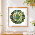 Finished botanical leaf mandala cross stitch artwork displayed