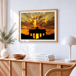 Brandenburg gate silhouette at sunset cross stitch artwork displayed on wall as home decor