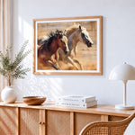 Brown and white horses running cross stitch artwork displayed on wall as home decor