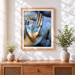 Finished buddha hand holding heart cross stitch artwork displayed