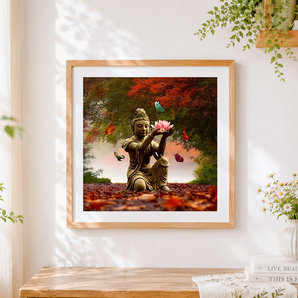 Finished buddha holding lotus with butterflies cross stitch artwork displayed