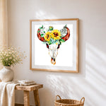 Bull skull with sunflowers cross stitch artwork displayed on wall as home decor