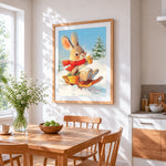 Bunny on a sledge with hot chocolate cross stitch artwork displayed on wall as home decor