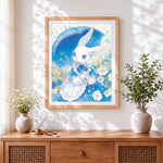 Finished bunny with umbrella among flowers cross stitch artwork displayed