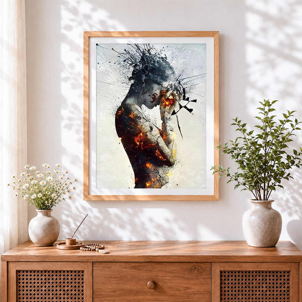 Finished burning broken figure cross stitch artwork displayed