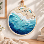 Bustling ocean surf embroidery hoop wall art displayed as warm and cosy handmade home decor