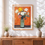 Finished buttercups and anemones in a glass vase cross stitch artwork displayed