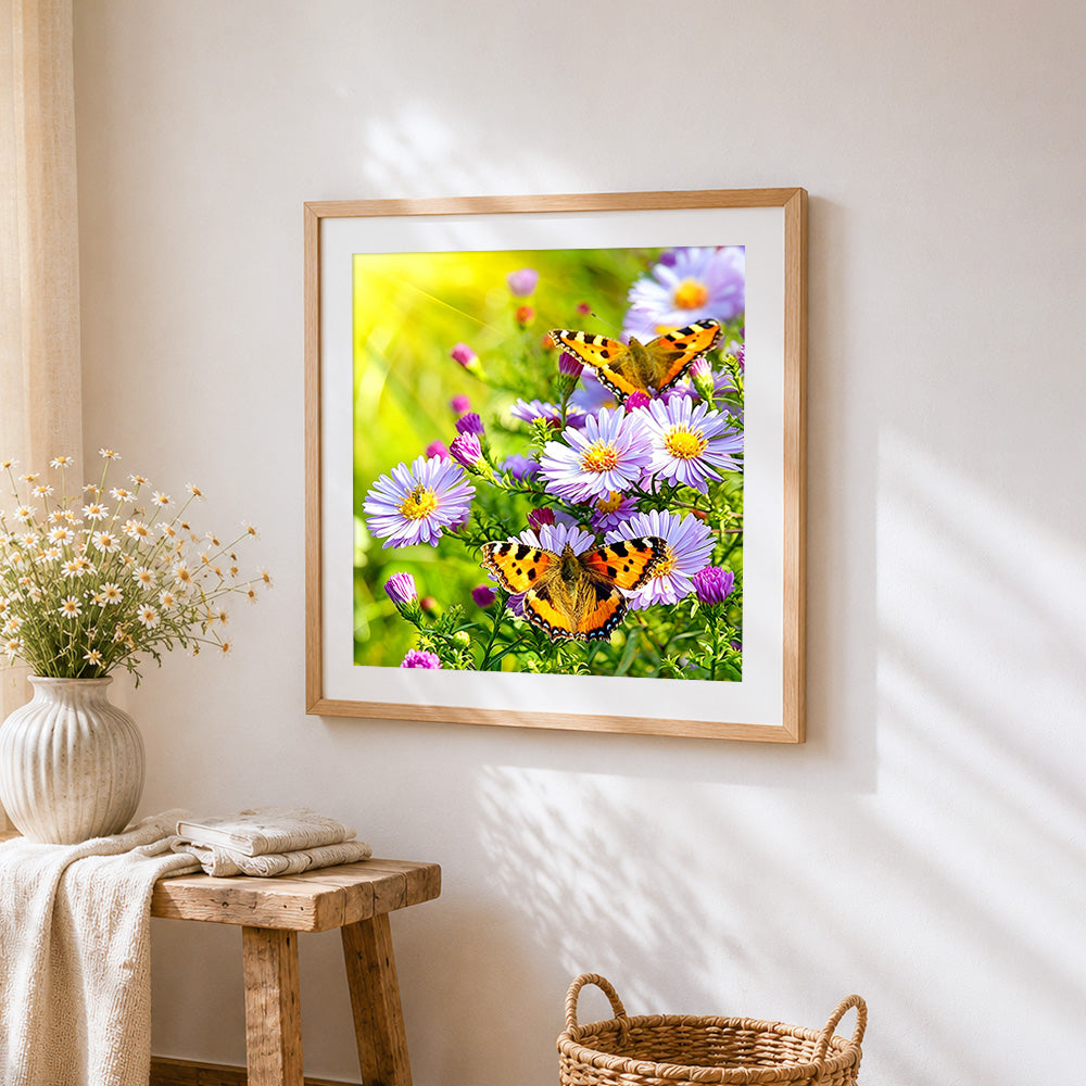 Butterflies on purple wildflowers cross stitch artwork displayed on wall as home decor