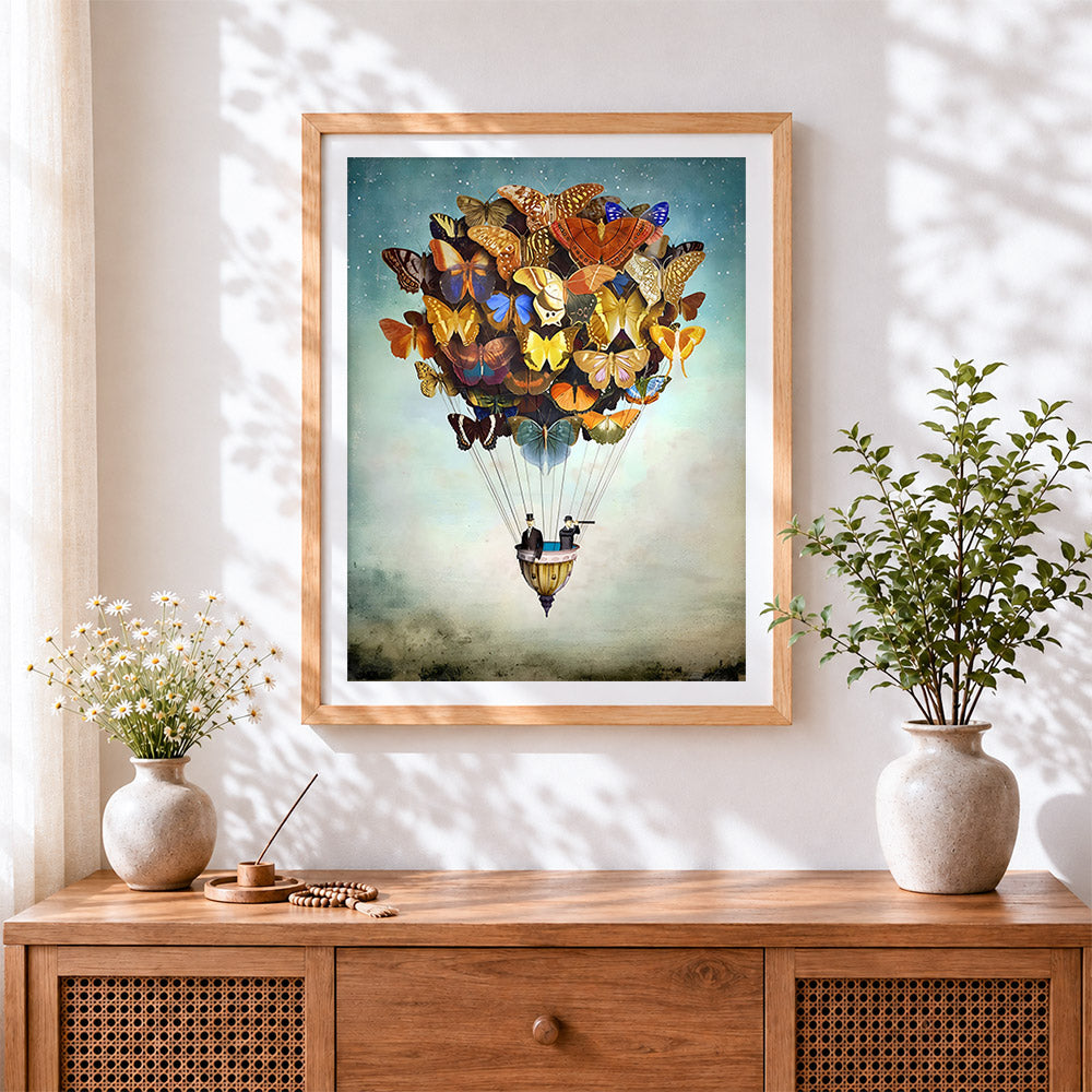 Finished butterfly hot air balloon cross stitch artwork displayed